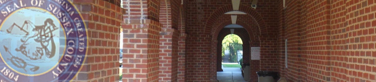 Picture of arches outside of Sussex County Courthouse. Cover